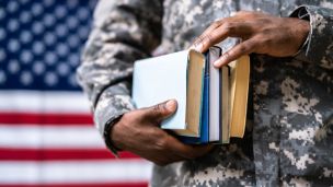 Veteran holding books